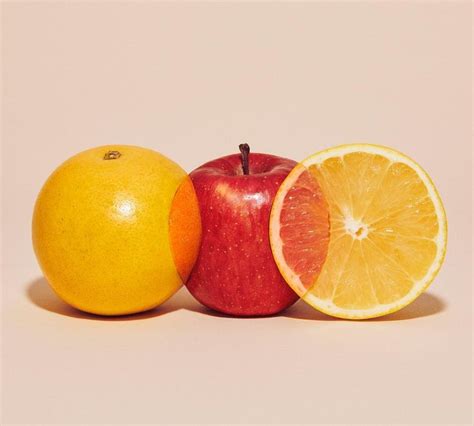 Apples And Oranges Come Together In Photographs Of Spliced Fruits By