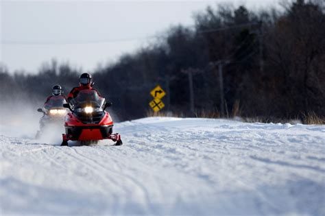Showcasing The Dnr Michigans Wintry Snowmobile Wonderland