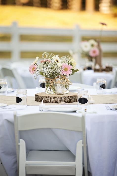 Rustic Wild Flower Centerpieces On Wood Rounds Rustic Wedding Table