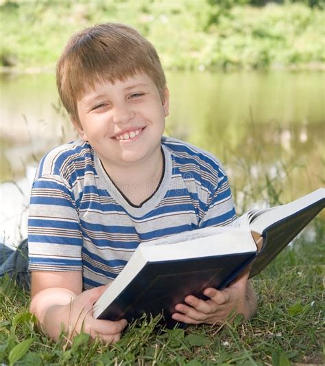 Happy Little Boy Reading Book In The Garden Stock Image Image Of