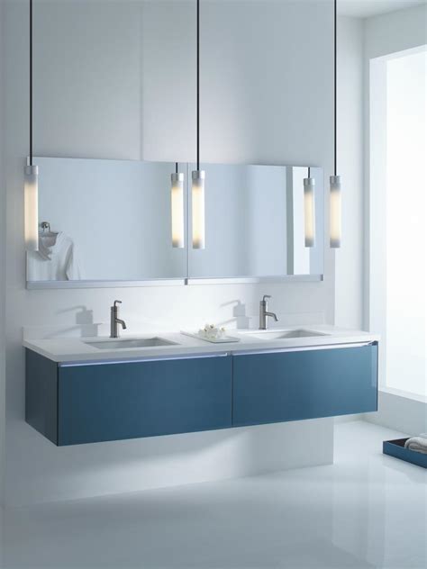 Furniture style bathroom vanity design with dark stain and carrara marble countertop designed by rockwood cabinetry. 9 Bathroom Vanity Ideas | HGTV