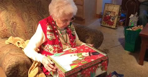 It is the modern comfort relaxing rocking chair for old ladies. Grandma tears paper from Christmas gift - look at her ...