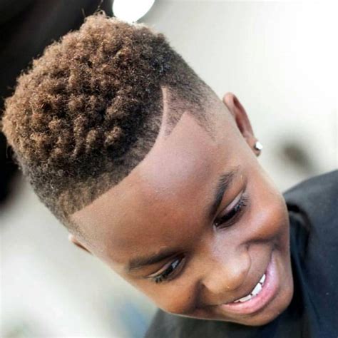 The curly mohawk, one of the coolest black boys' haircuts that combine the appeal of a thick curly top with faded sides. 30 Marvelous Black Boy Haircuts - For Stunning Little ...