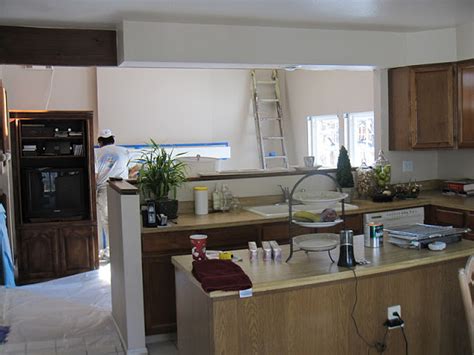 These melamine and oak trim cabinets were all the rage in the 80's, but now they look sad and dated. Simple Details: 80's tract home kitchen makeover...
