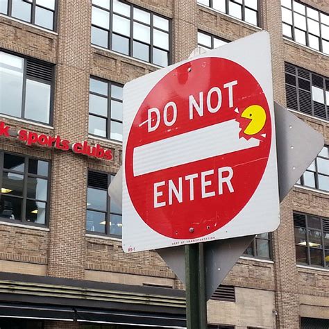 Street Artist Adds Whimsy To Street Signs With His Clever Custom Stickers