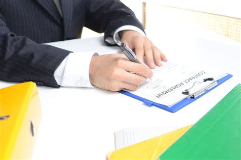 Man In Suit Signing Documents Stock Image Image Of Professional