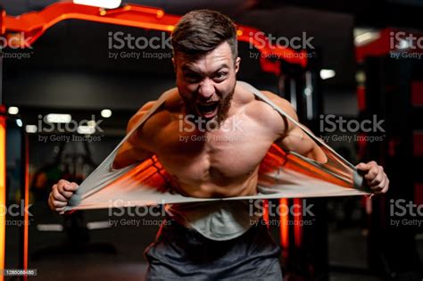 Brutal Strong Athletic Man Tearing Undershot Workout And Bodybuilding