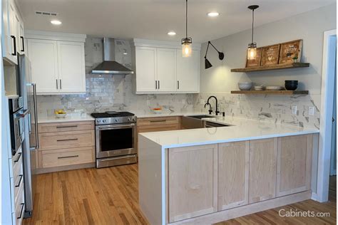 It is a perfect option for modern homeowners who are primarily interested in creating aesthetics in their kitchens before looking at the function. Modern White and Natural Maple Kitchen with Black Hardware ...