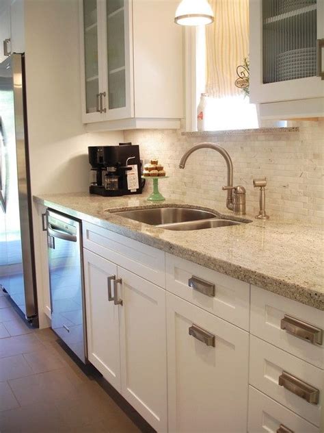 Maybe you would like to learn more about one of these? White Shaker style cabinets with modern brushed nickel ...