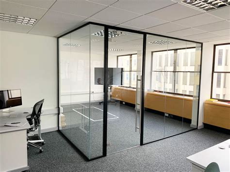 acoustic glass partition with framed door in black ral 9005 for acquia inc in brighton east