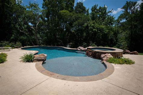 Slope meaning, definition, what is slope: Sloped Yard - Allison Landscpe & Pool Company