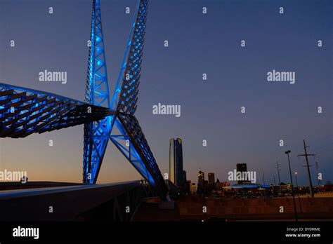 View Of Skydance Bridge And Oklahoma City Skyline At Dusk Stock Photo