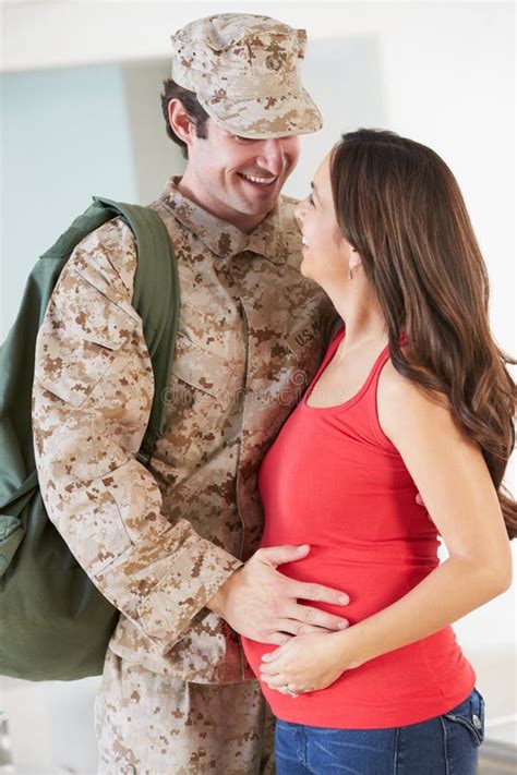 pregnant wife greeting military mother home on leave stock image image of husband cuddling
