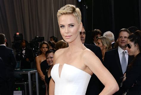 Charlize Theron Still Standing After Red Carpet Body Check