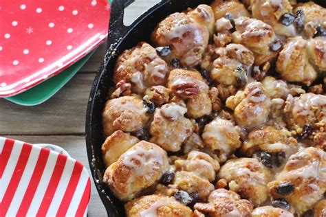 Homemade monkey bread combines several tiny balls of dough coated in butter, cinnamon, and sugar. Skillet Monkey Bread | Syrup and Biscuits