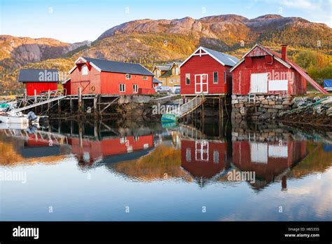 Traditional Norwegian Red Wooden Barns Stand On The Sea Coast Stock