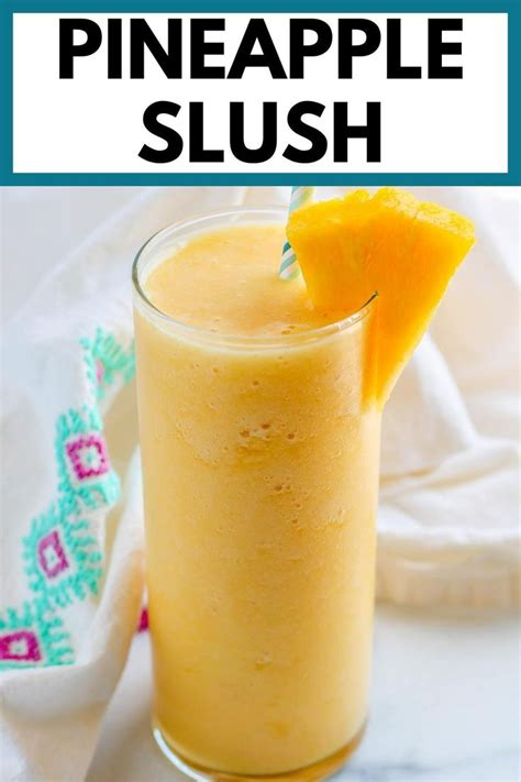 A Pineapple Slush Is Garnished With An Orange Slice And Served In A
