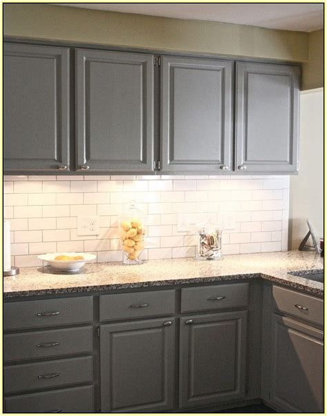 Choosing a marble backsplash for white cabinets means you are keeping the kitchen bright, but still with a bit of texture thanks to the grey coloring throughout. Gray Cabinets White Subway Tile Backsplash | Gray subway tile backsplash, Subway tile backsplash ...