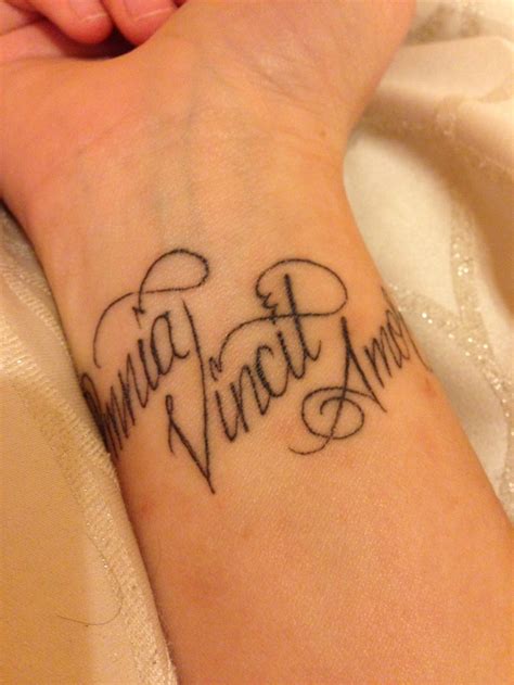 omnia vincit amor wrist tattoo love conquers all in latin body art pinterest thin line