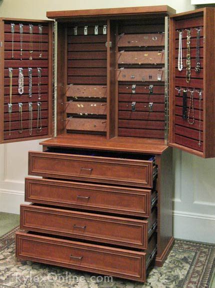 Store your jewelry in an armoire designed to keep your collection organized and right at your fingertips. jewelry cabinet, earring cards | Jewelry cabinet, Jewelry ...