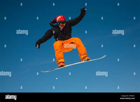 A Free Style Boarder Executes A Jump Against A Clear Blue Sky 3 Of 3