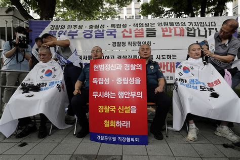 S Korean Police Shave Heads In Relay Protest Of Threat To Neutrality