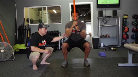The Dunphy Squat The Squat Made Better Stick Mobility Exercise