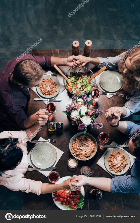 Friends Praying Before Dinner — Stock Photo © Tarasmalyarevich 166311534