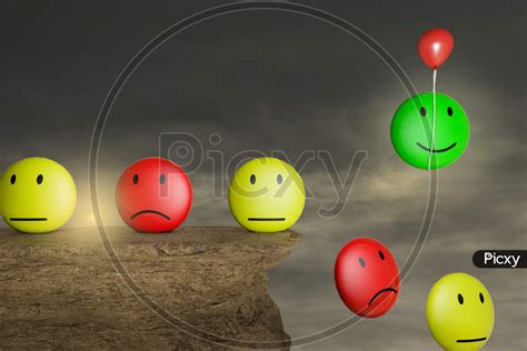 Image Of Emoji Emotions On A Stone Cliff With A Red Balloon Help To