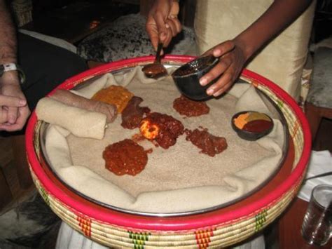 Ethiopian Food Injera With Loads Of Wot Sauce Different Kinds
