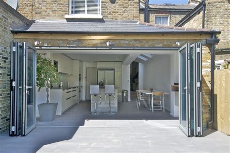 Some people like to use simple small knobs, the kind you would. Wrap Around Extension With Bi-fold Doors | The Art of ...