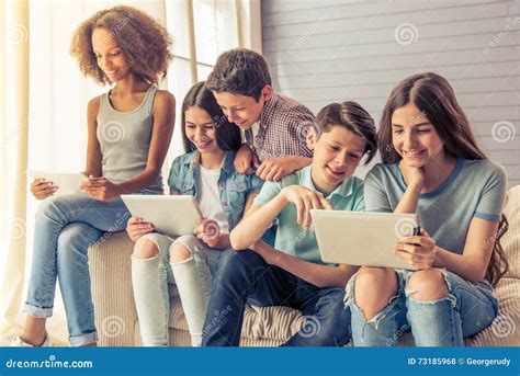 Teenagers With Gadgets At Home Stock Photo Image Of Sitting Smart