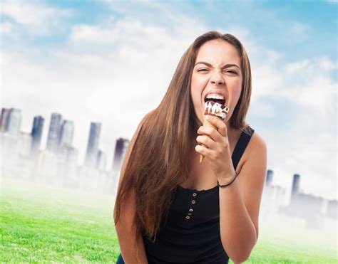 Free Photo Hungry Brunette Girl Biting Cone Ice Cream