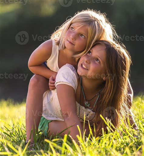 Little sisters 899858 Stock Photo at Vecteezy