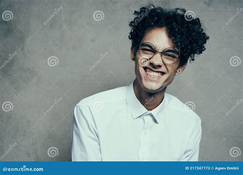 Portrait Of A Happy Guy With Glasses Curly Hair White Shirt Photoshoot Model Stock Image Image