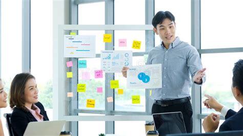 Businessman Presenting Business Plan Information At Office Meeting