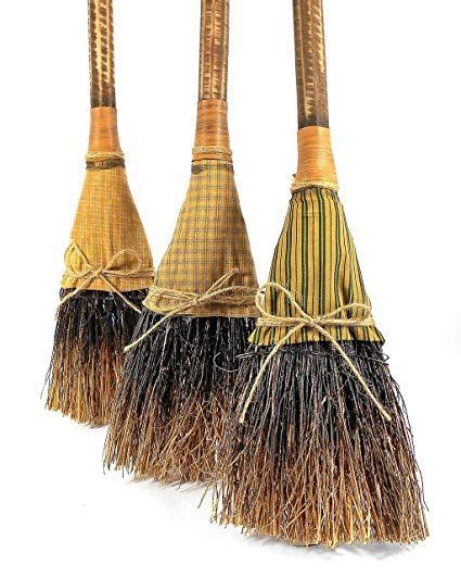 Three Brooms That Have Been Placed On Top Of Each Other