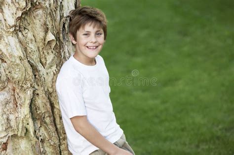 Teenage Boy Leaning Tree Trunk Stock Photos Free And Royalty Free Stock