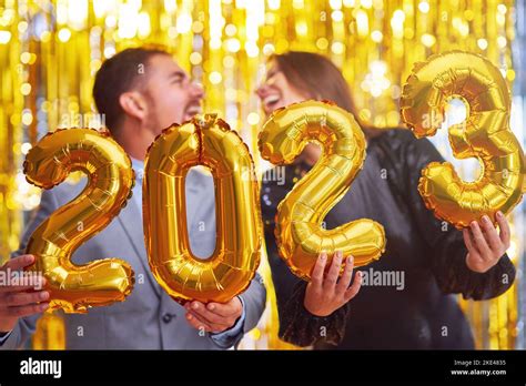 Couple At New Year Eve Party With Gold Balloons Stock Photo Alamy