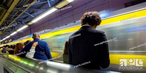 Passengers Traveling By Tokyo Metro Business People Commuting To Work By Public Transport In