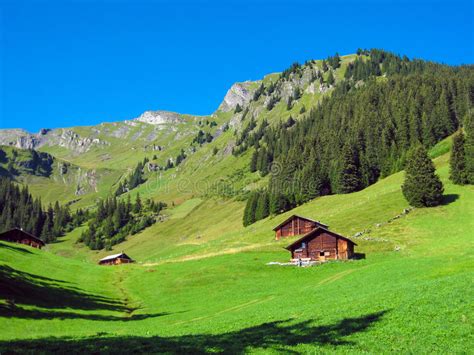 Beautiful Mountain Landscape In The Alps With Chalet In Springtime