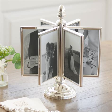 rotating silver plated multi aperture photo frame by jodie byrne
