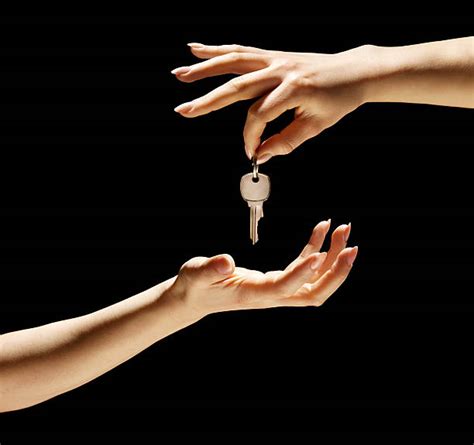 Black Hand Holding Key Stock Photos Pictures And Royalty Free Images