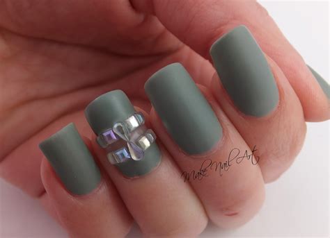 Matte Green Cut Out And Rhinestones Nail Art Design