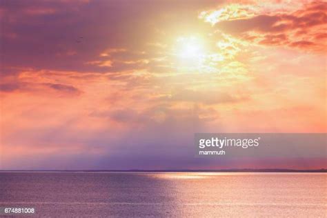 Sunset Over Water Photos And Premium High Res Pictures Getty Images