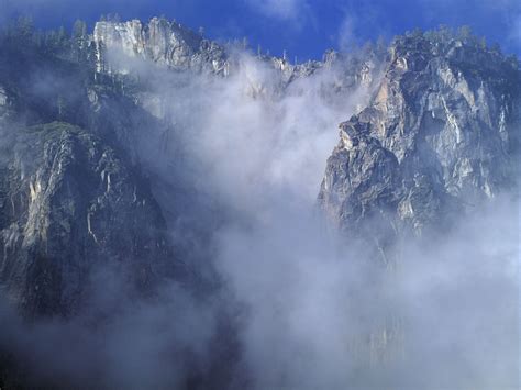 Cliff In Clouds Mountains Wallpaper