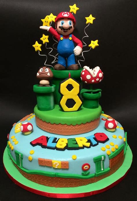 These classic gamer details are hand made to order, just pick your cake flavor and have this cake at your next party!outer frosting will be vanilla buttercream and fondant details for design Super Mario Cake - cake by Davide Minetti - CakesDecor