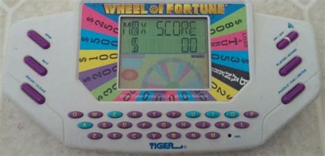 1995 Tiger Wheel Of Fortune Handheld Electronic Game W Cartridge