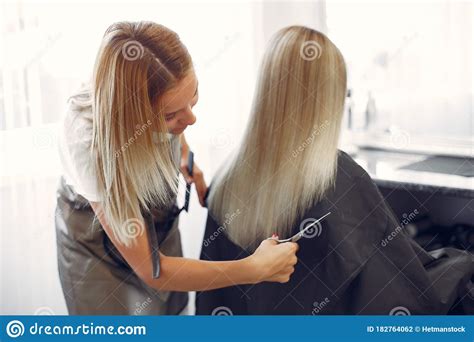 Hairdresser Cut Hair Her Client In A Hair Salon Stock Photo Image Of