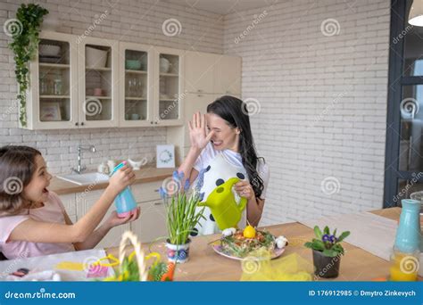 Brunette Woman And Her Pretty Daughter Having Fun In The Kitchen Stock Image Image Of Cheerful